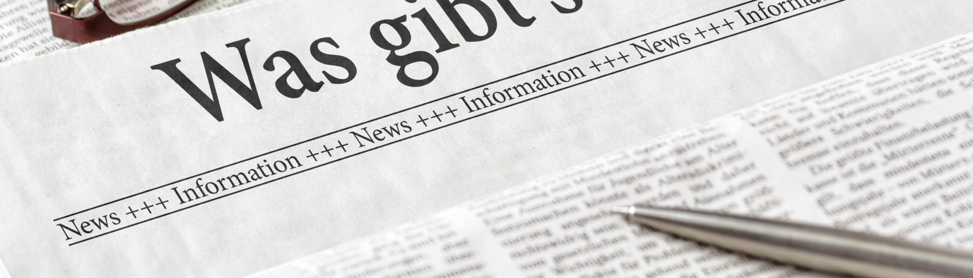 Zeitung mit der Überschrift Was gibts Neues